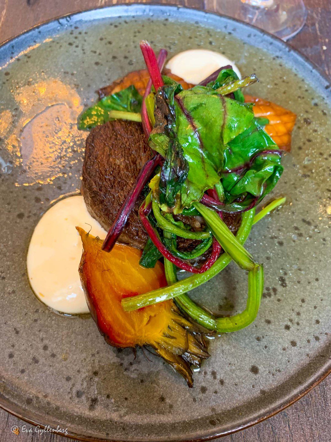 Piece of meat with oven-roasted vegetables at a restaurant in Lund