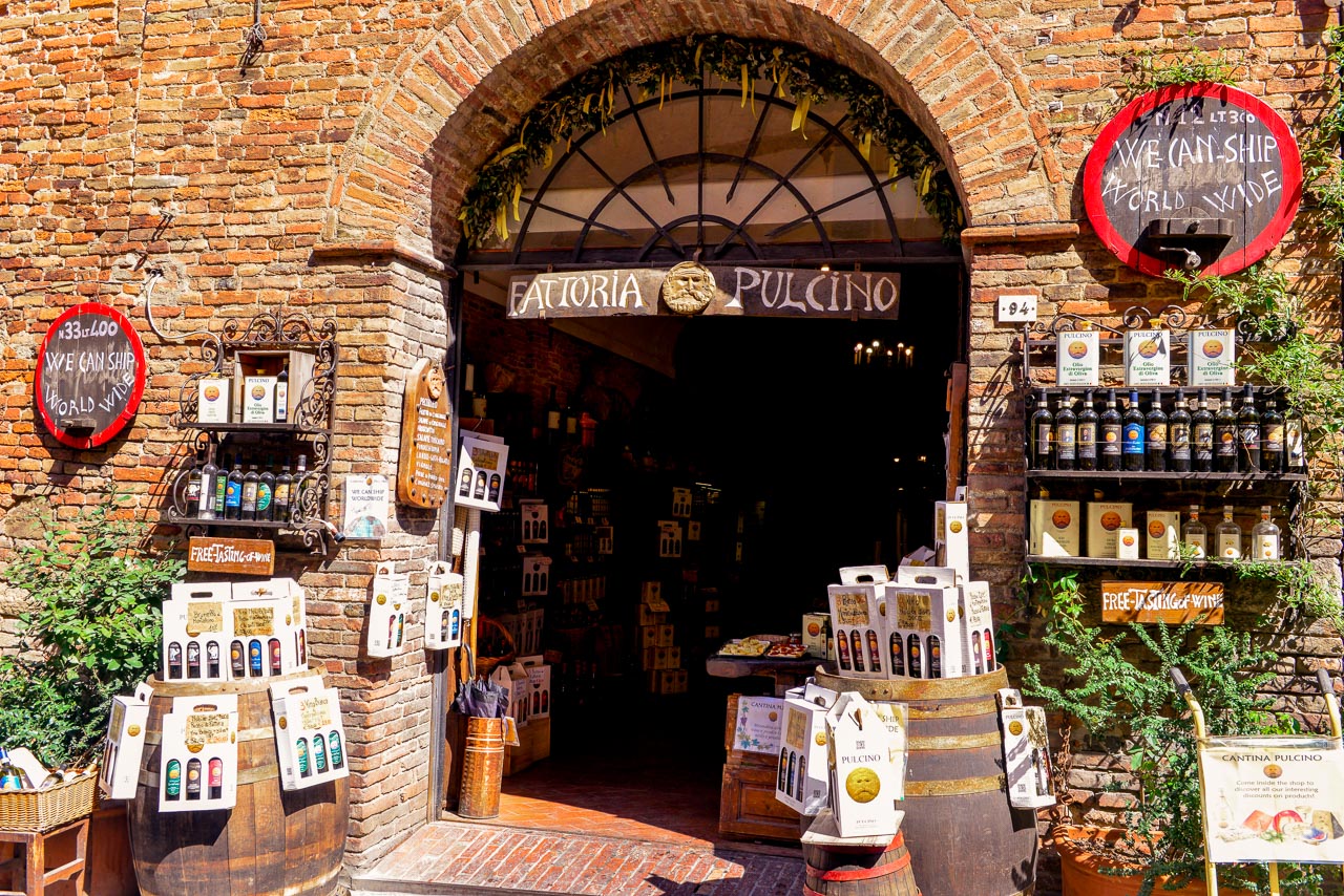 Wine shop with lots of wine bottles on the street