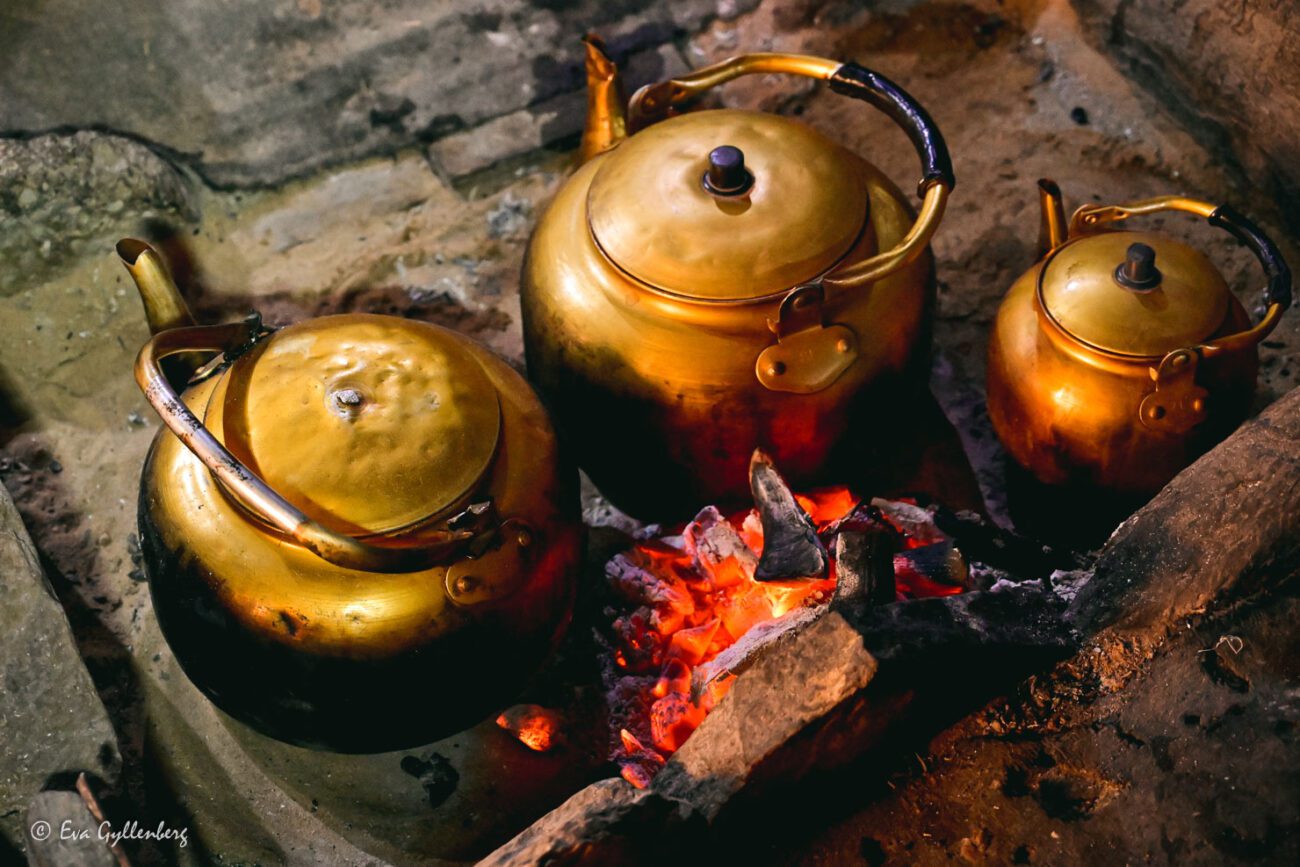 Three copper cauldrons on fire